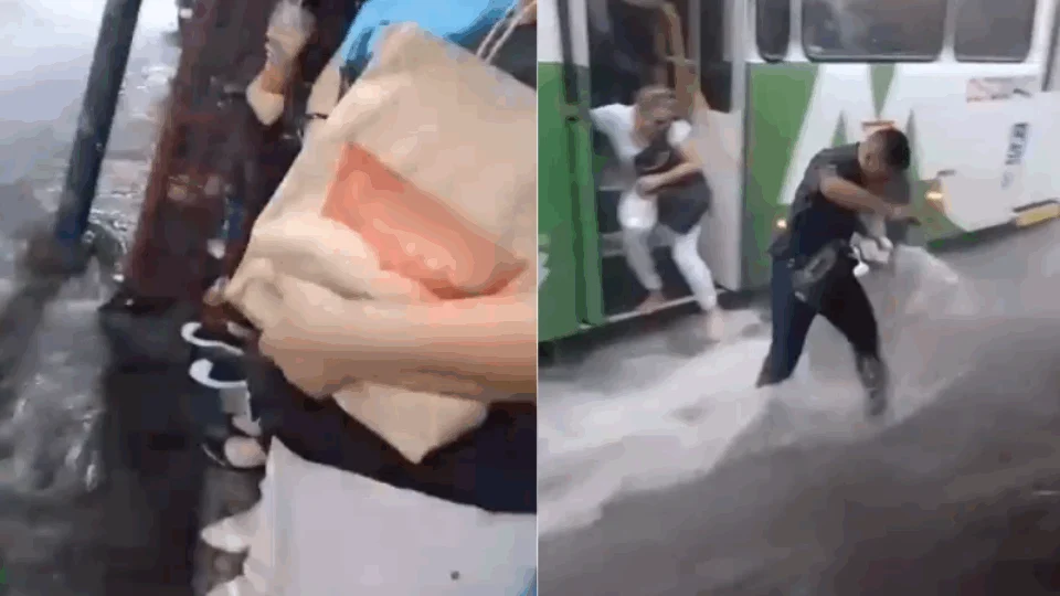 Passageiros de ônibus  fogem de alagamento no Centro de Manaus