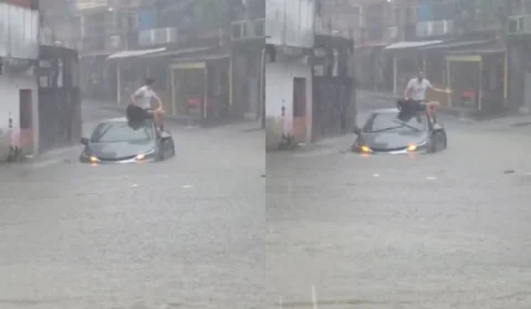 Motorista sobe no teto do carro ao ficar ilhado em alagamento durante forte chuva na zona sul de Manaus