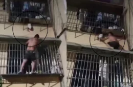 Veja: Homem salva bebê que ficou pendurado pela cabeça em janela do 2º andar de apartamento na China