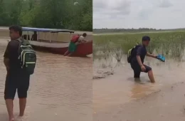 SEM CAMINHO: estudantes empurram barcos na lama para conseguir ir à escola no Bailique